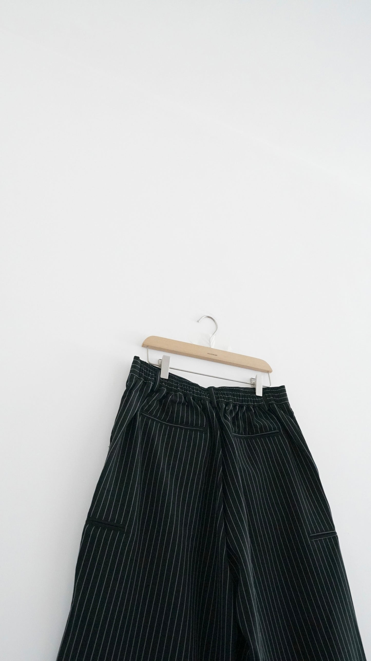 striped low-rise tailored shorts in black (pre-order)