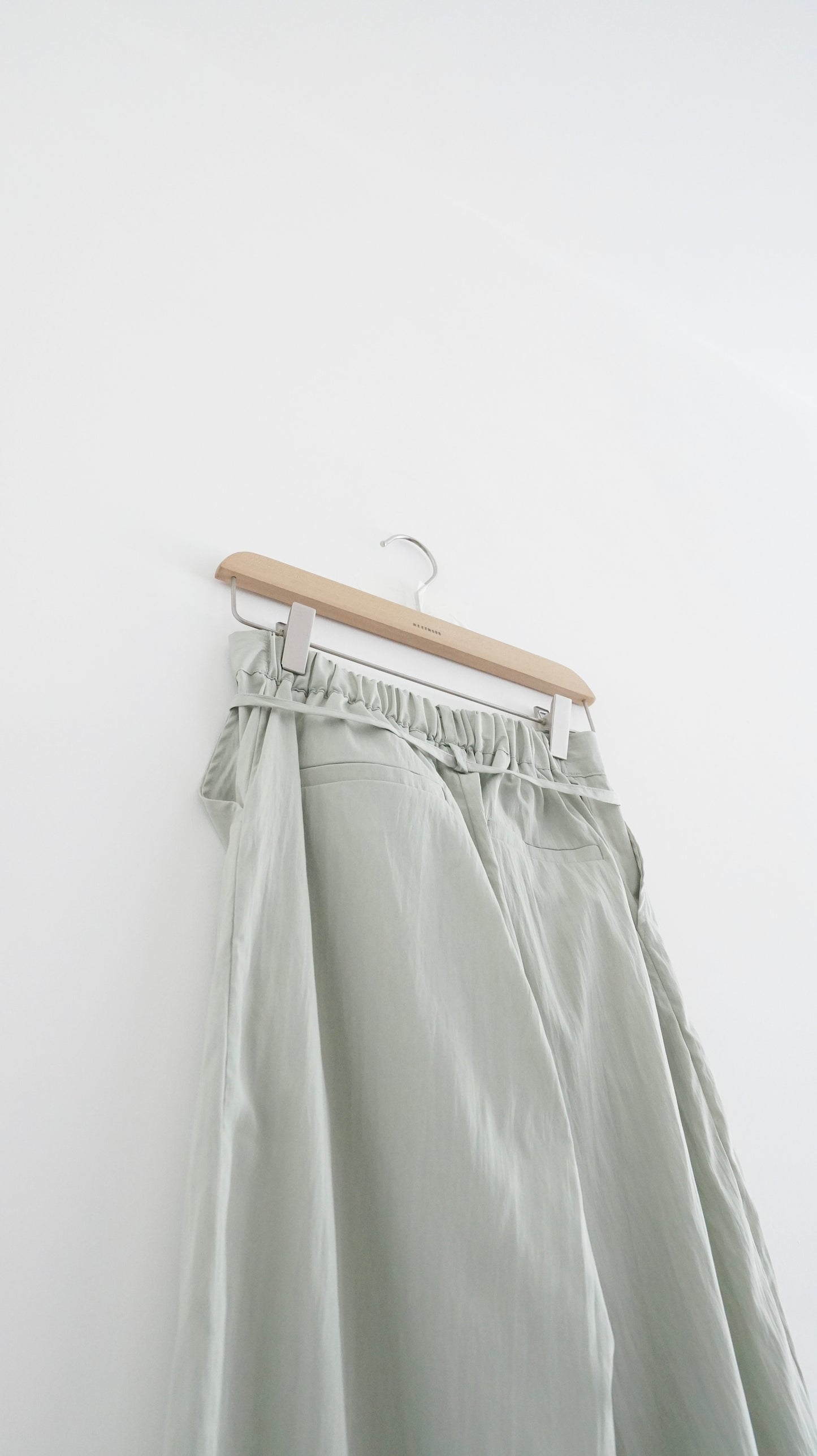 silken pleated tailored trousers in light green