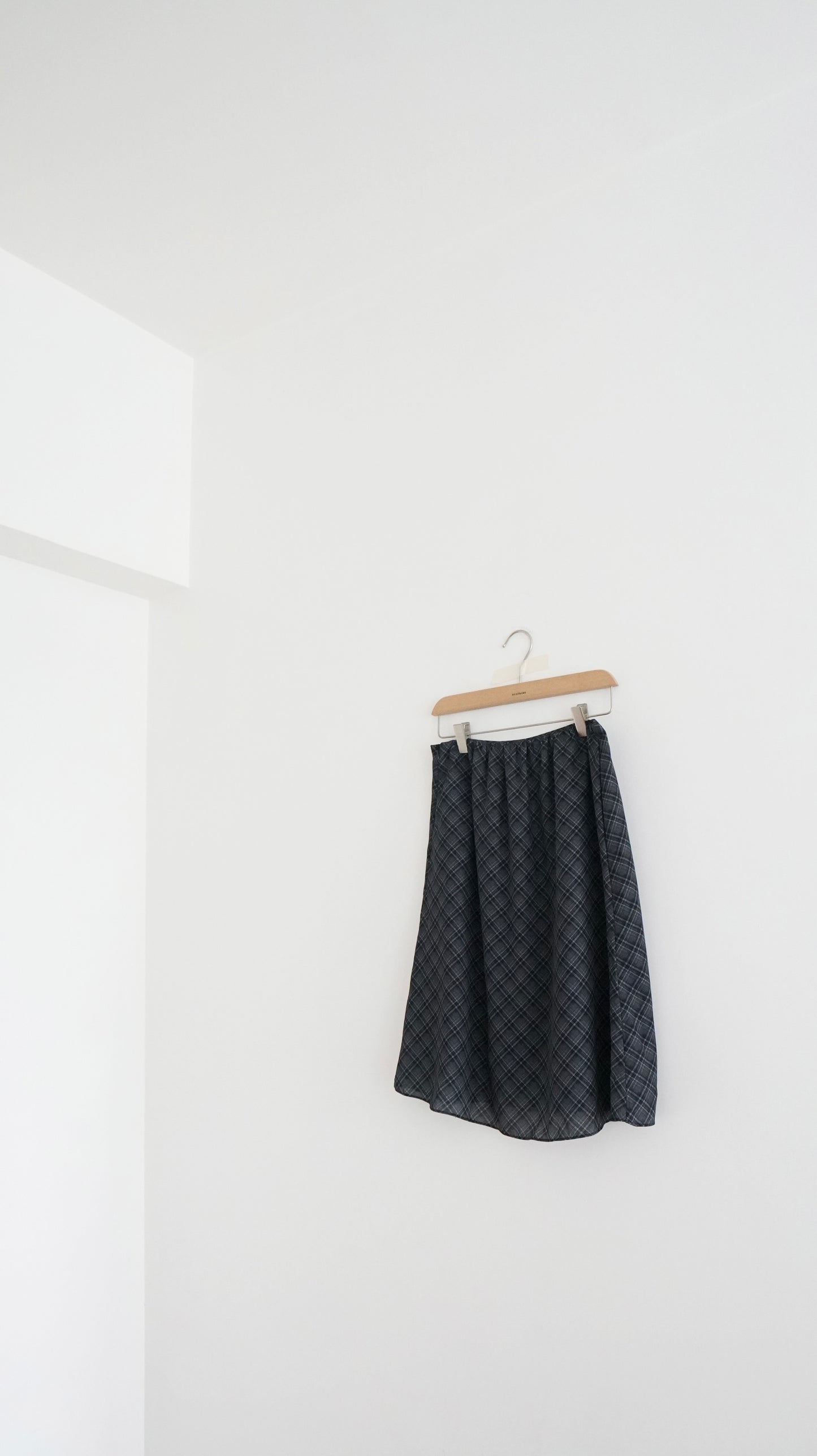 plaid lightweight midi skirt in black (pre-order)