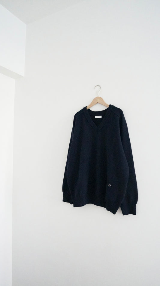classic gender free v-neck wool sweater in navy
