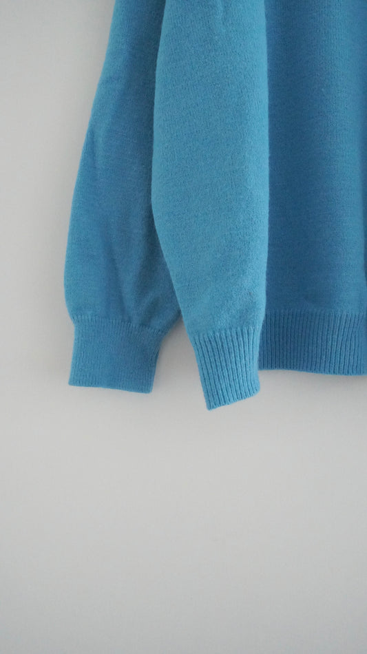 classic gender free v-neck wool sweater in lake blue