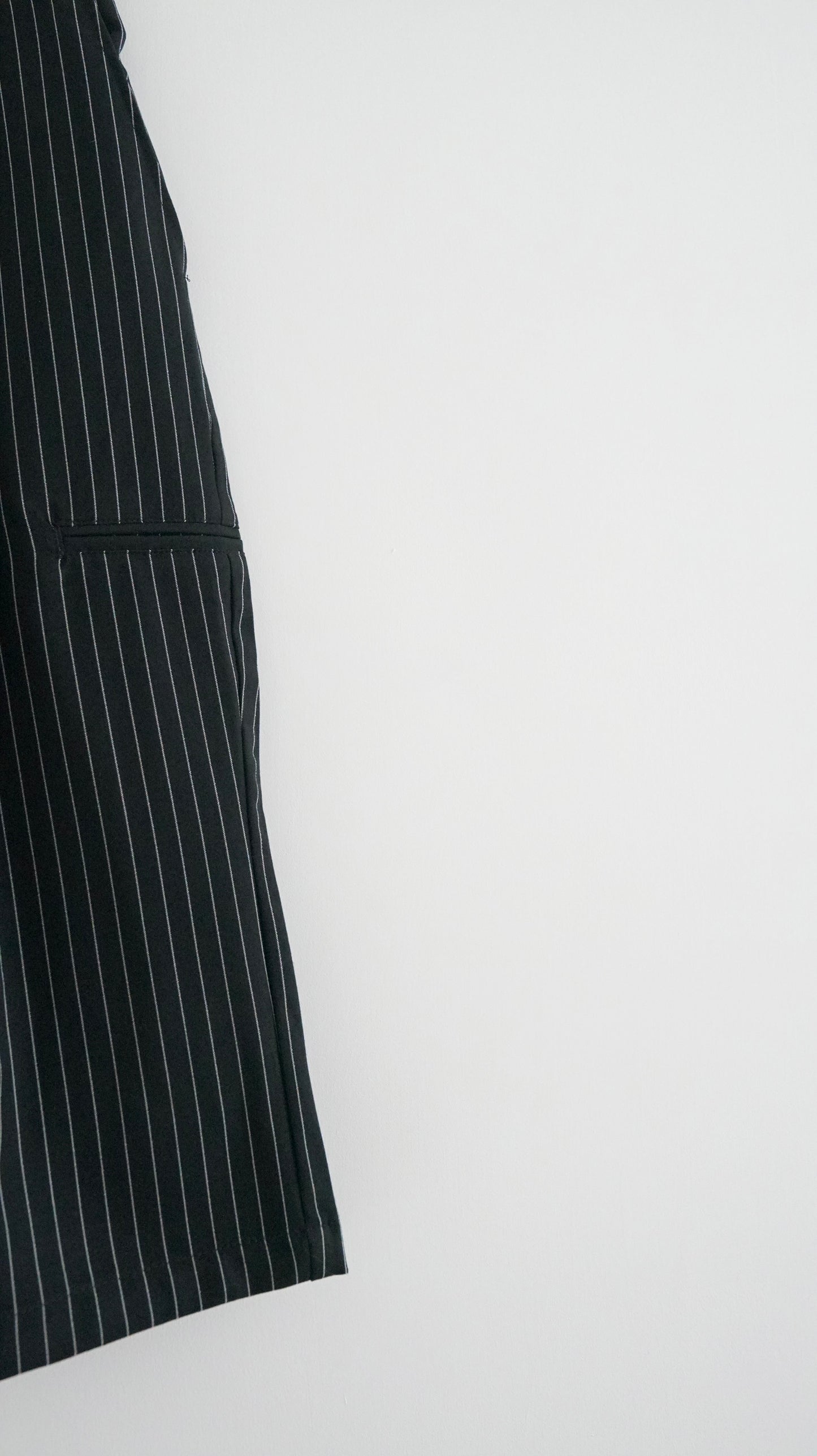 striped low-rise tailored shorts in black (pre-order)