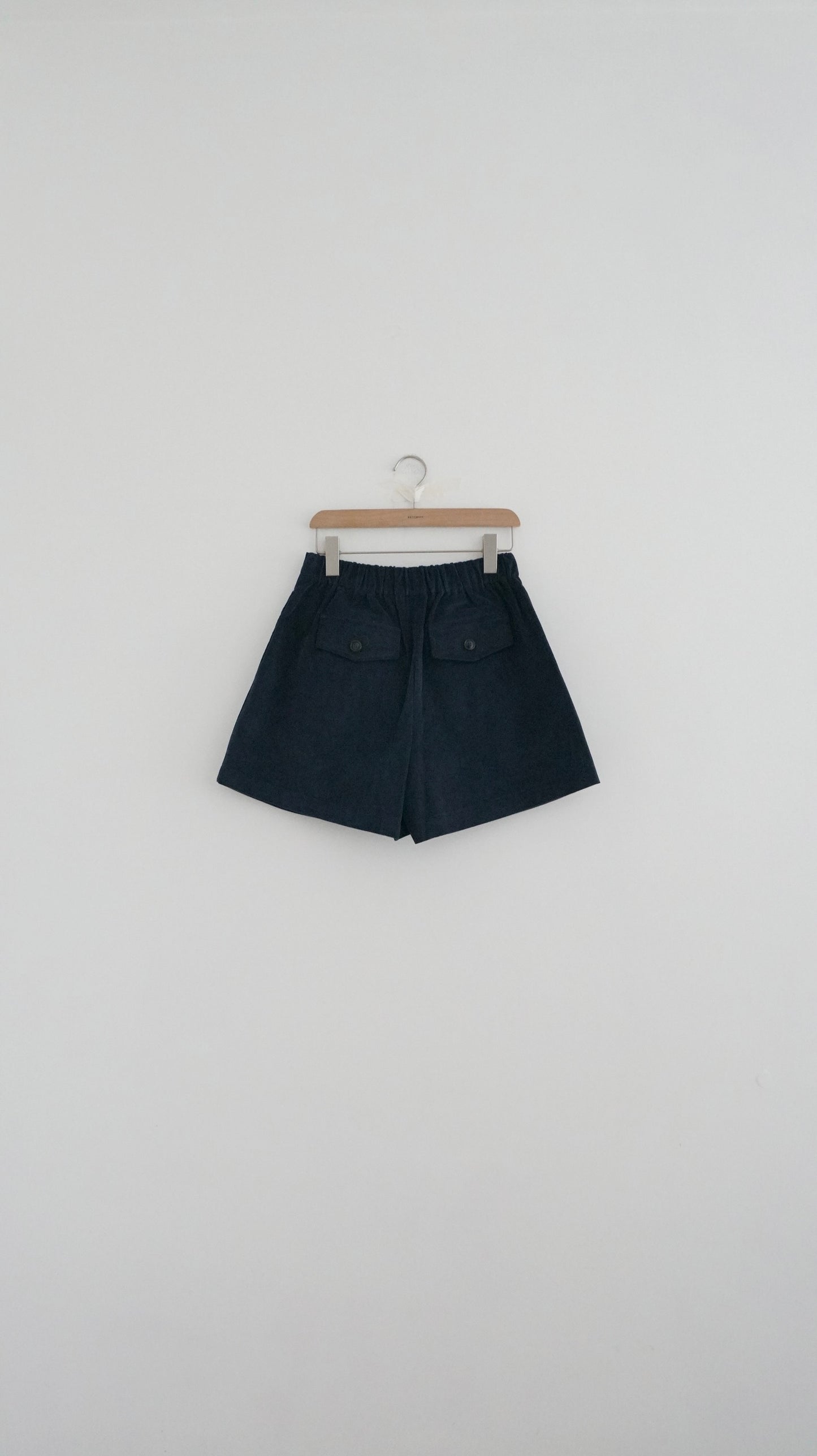 pleated corduroy shorts in navy (pre-order)