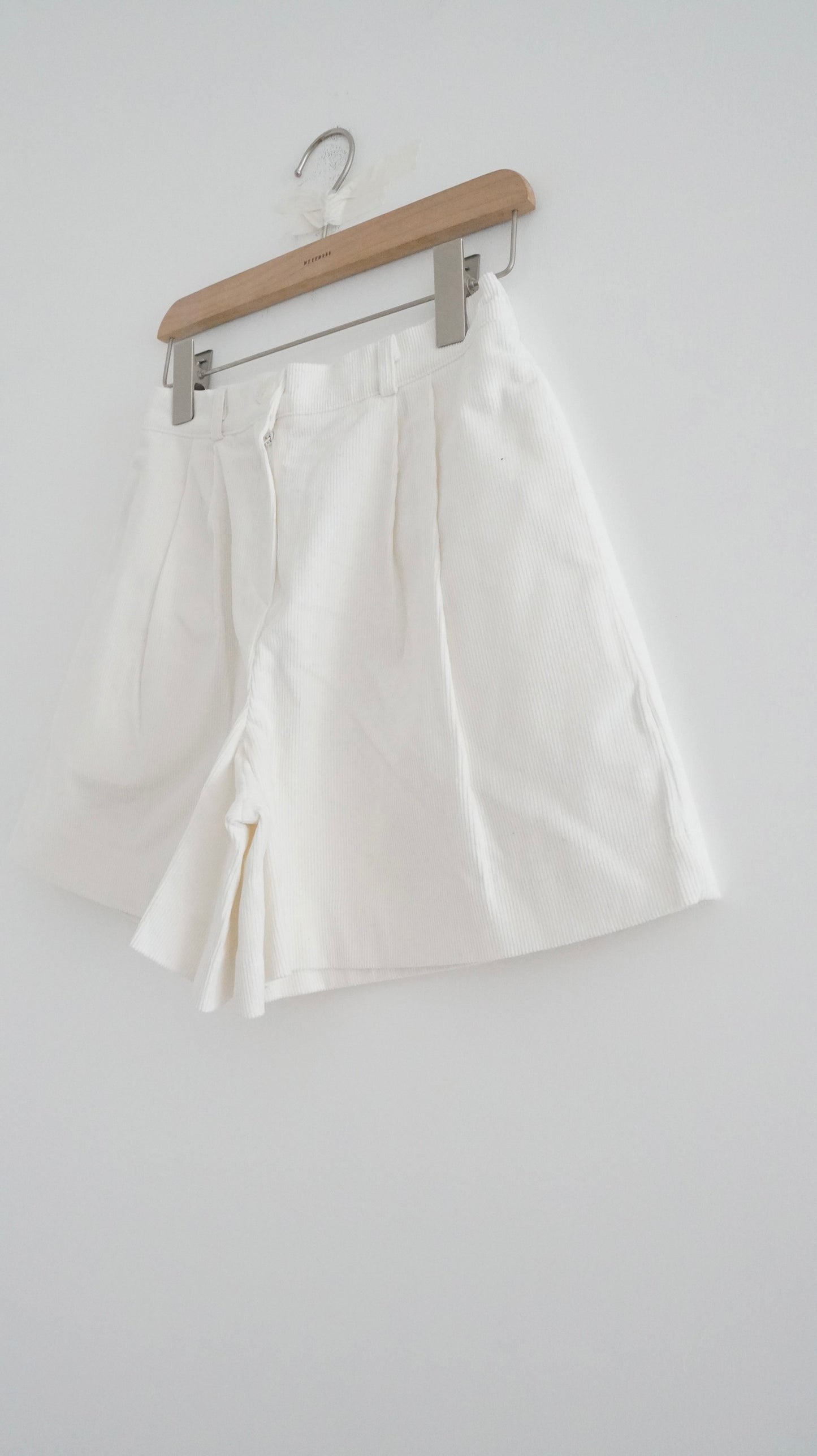 pleated corduroy shorts in white (pre-order)