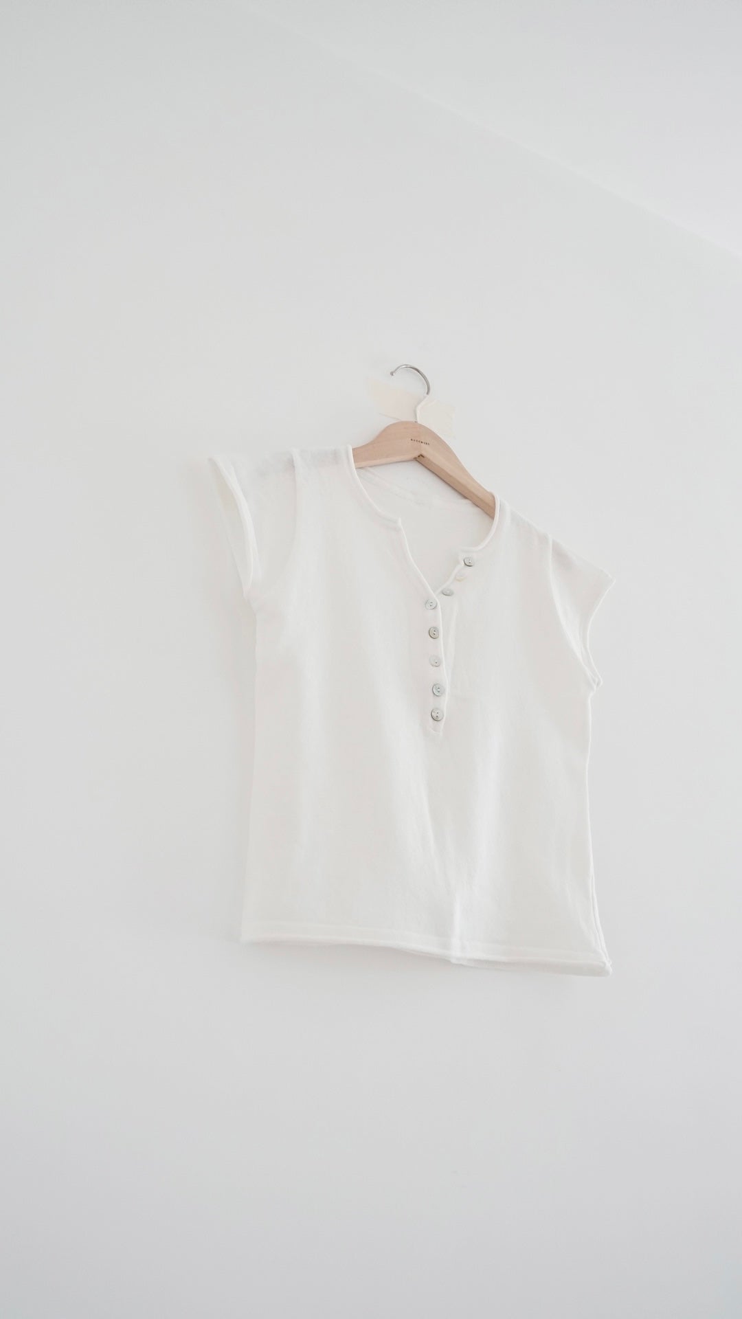 soren minimalist button knit top in white (pre-order)