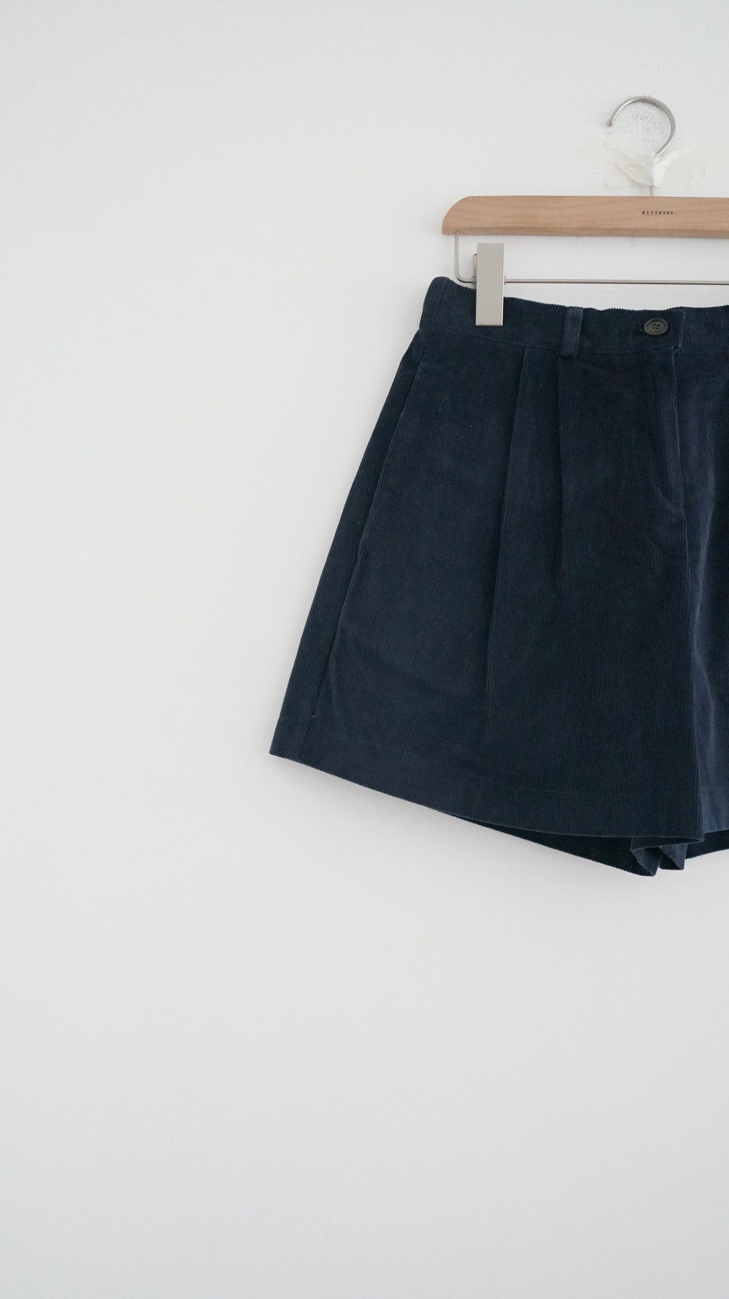 pleated corduroy shorts in navy (pre-order)