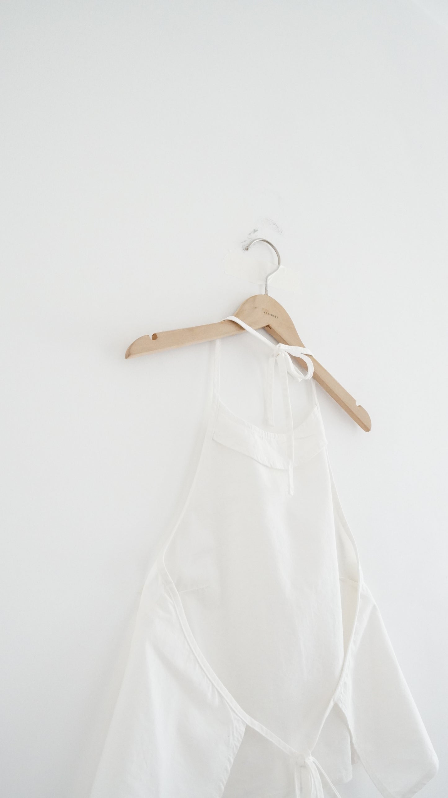 minimalist halter neck top in white