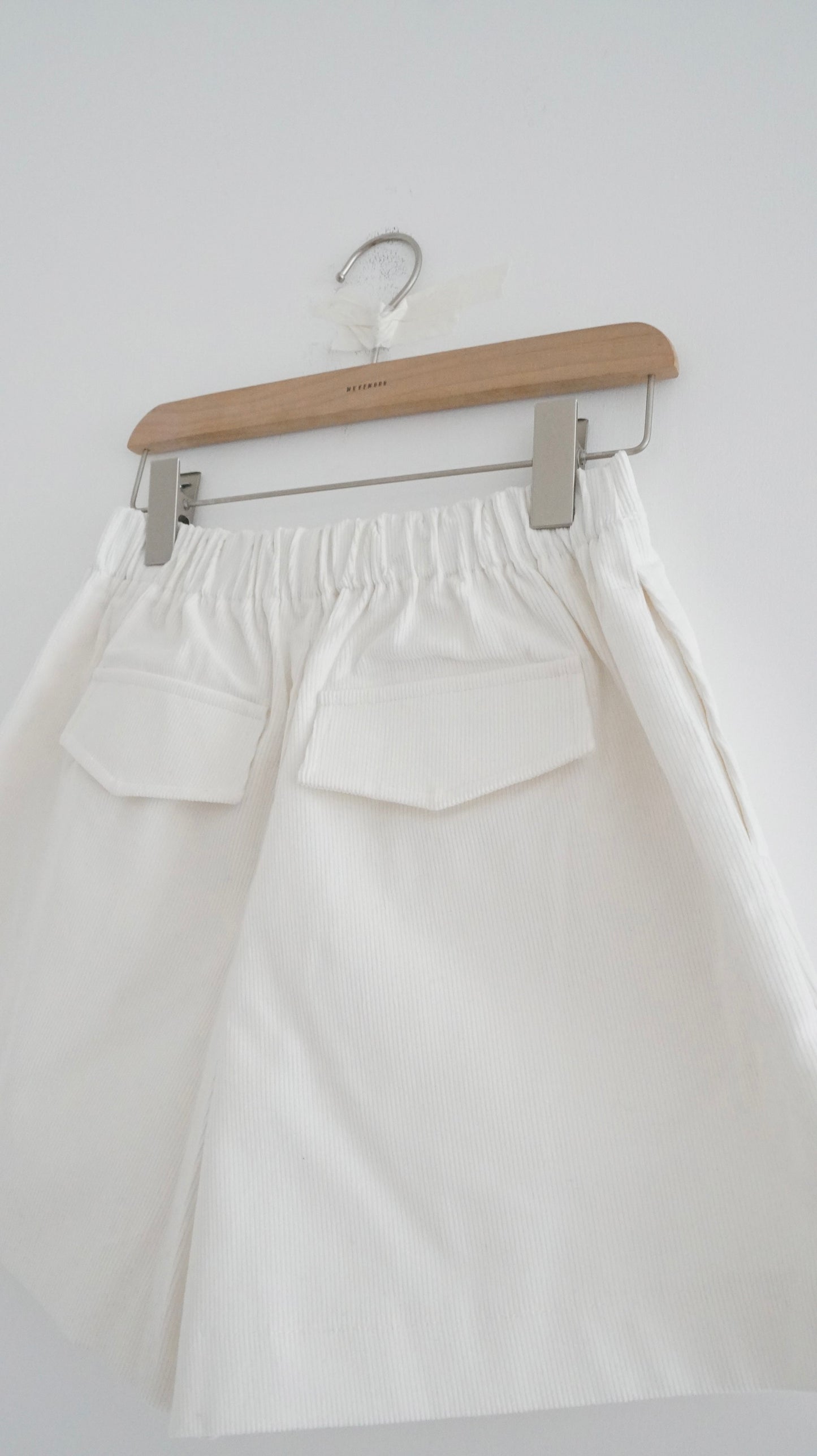 pleated corduroy shorts in white (pre-order)