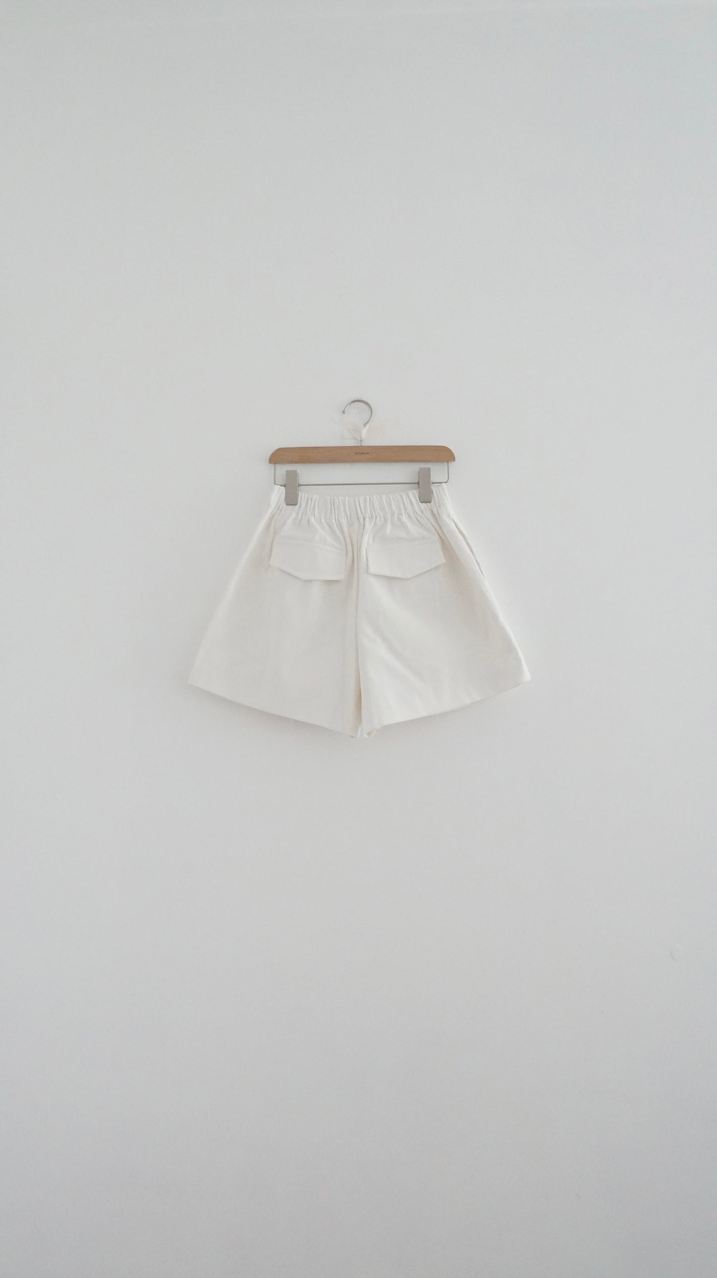 pleated corduroy shorts in white (pre-order)