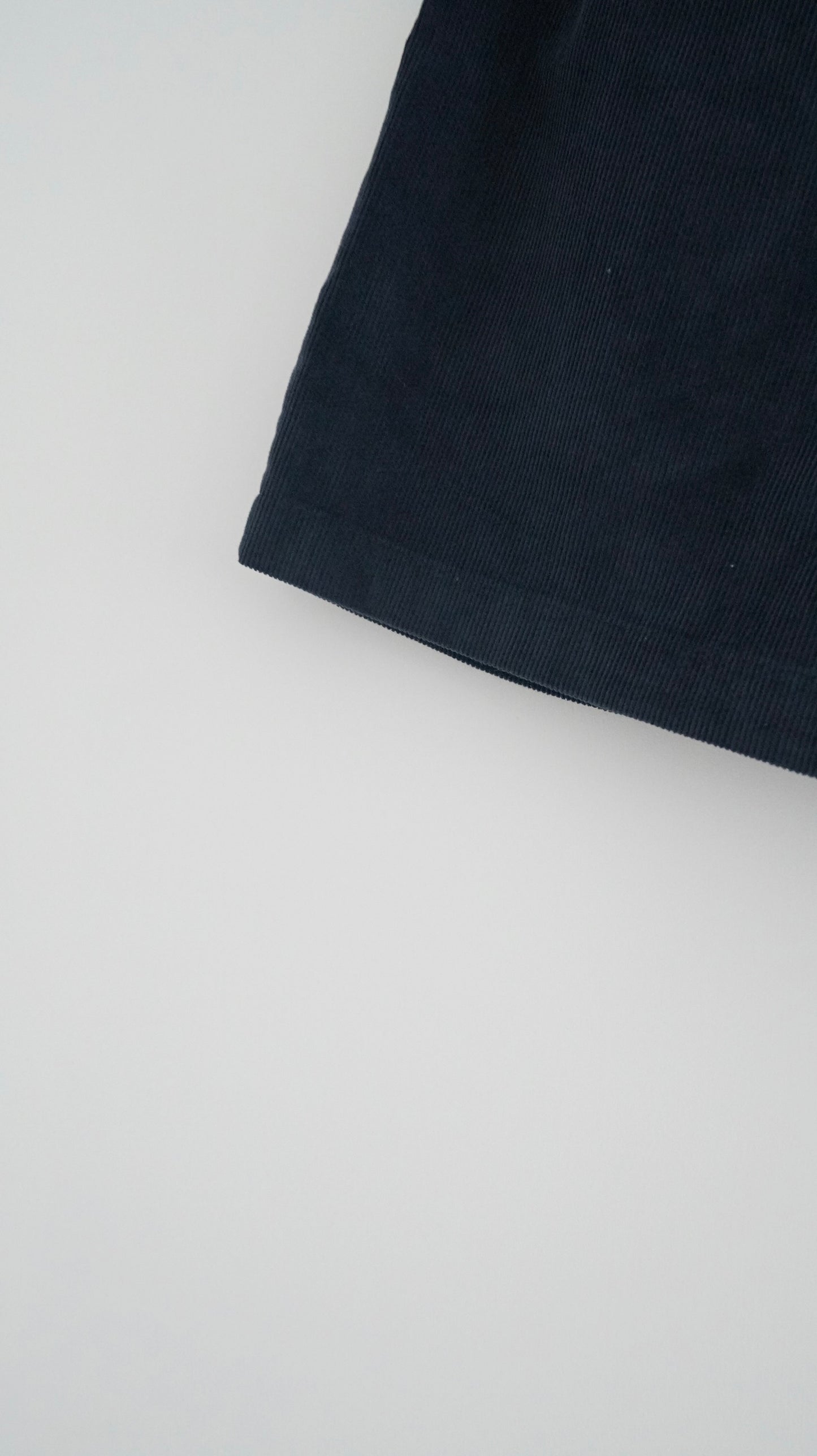 pleated corduroy shorts in navy (pre-order)