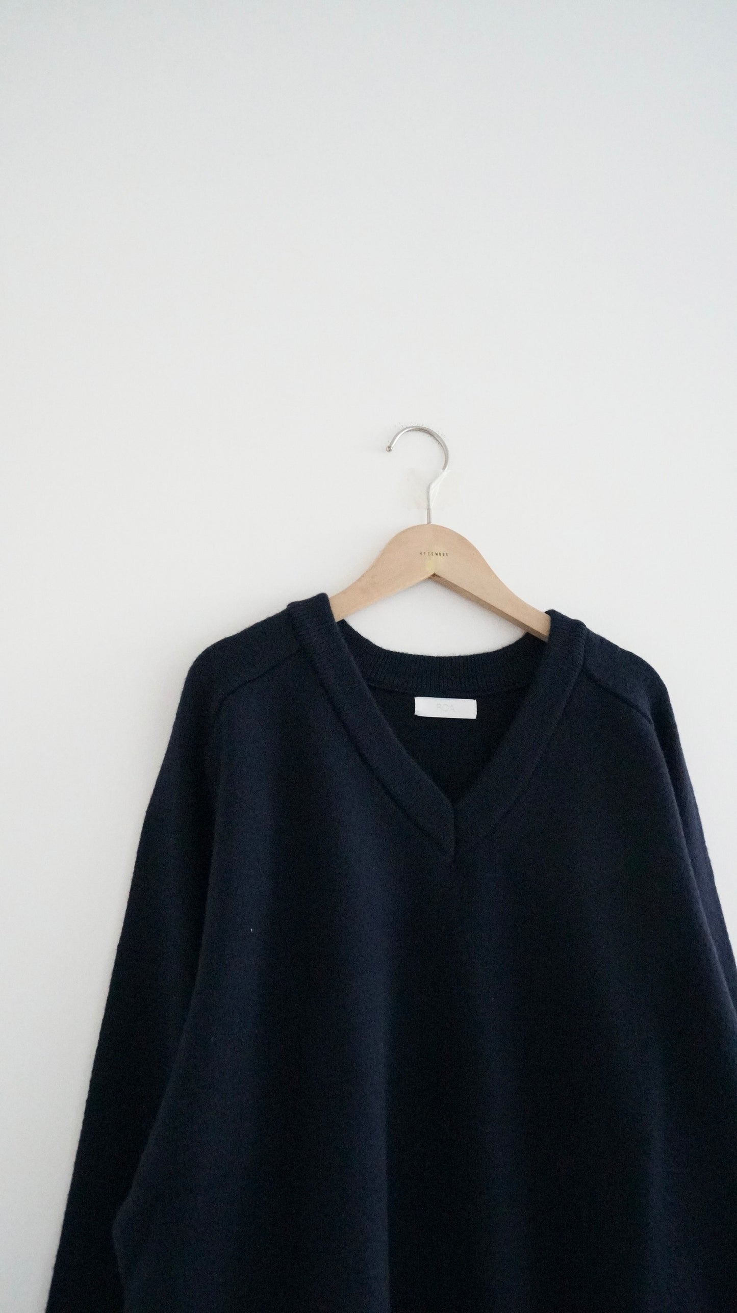classic gender free v-neck wool sweater in navy