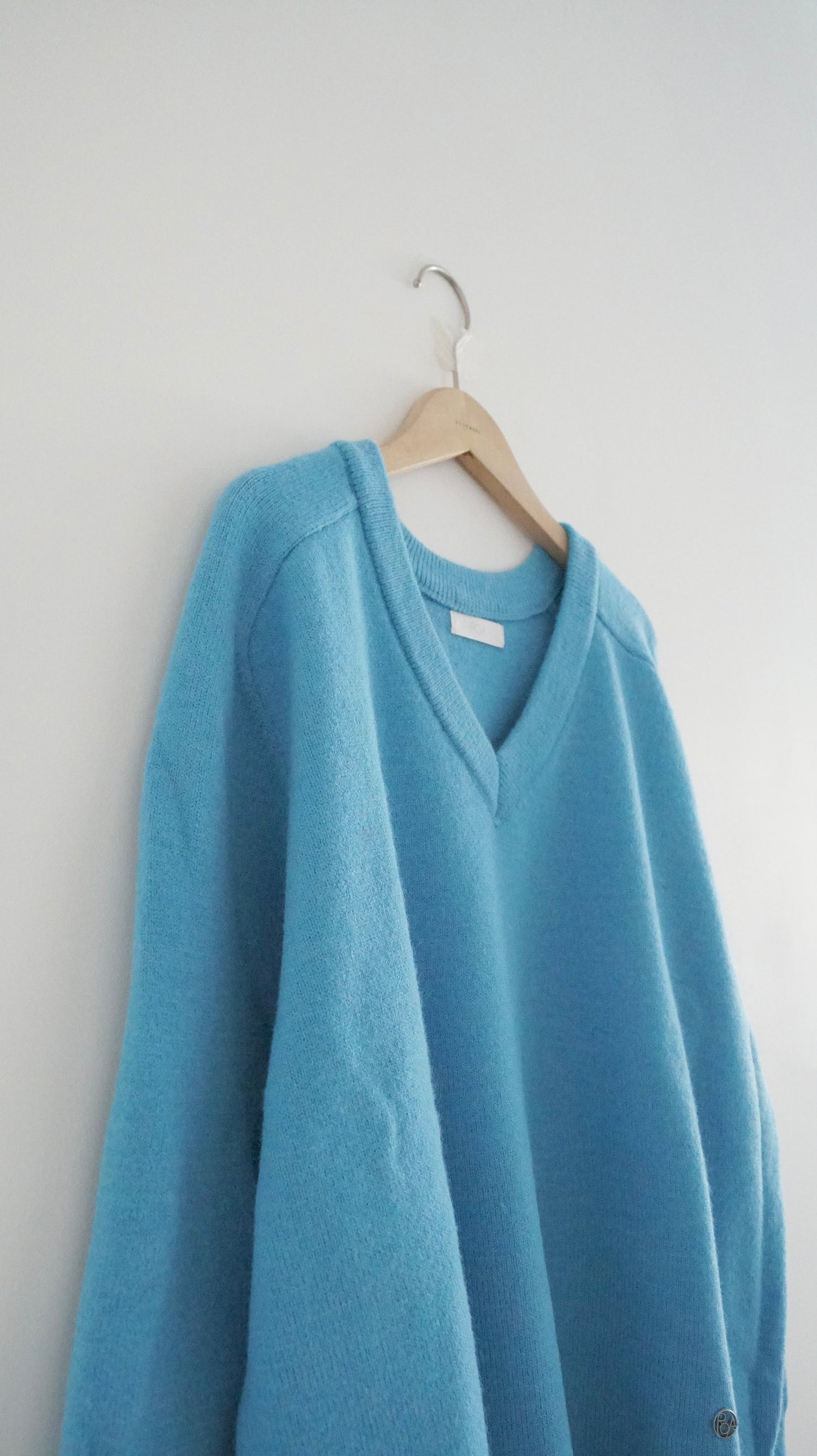 classic gender free v-neck wool sweater in lake blue