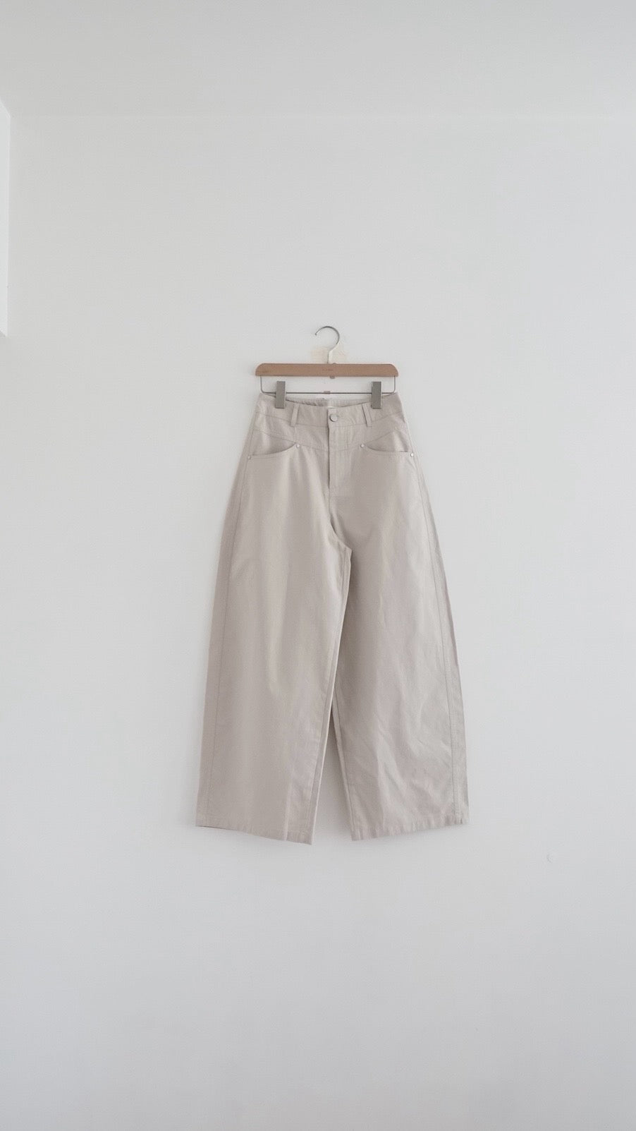 kaze curved seam wide-leg trousers in beige (pre-order)