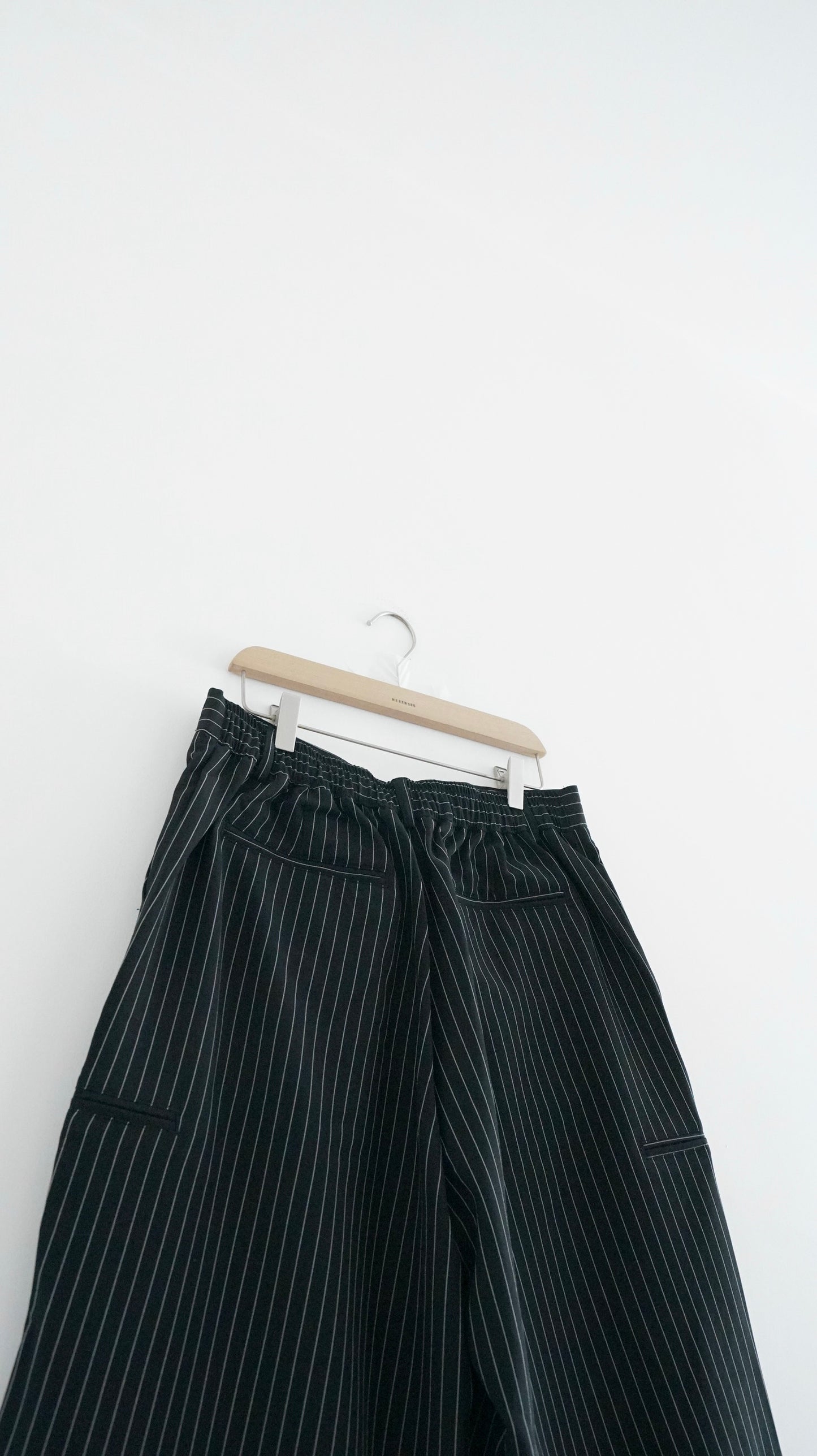 striped low-rise tailored shorts in black (pre-order)